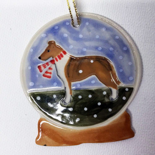 smooth coat collie wearing red scarf on ornament